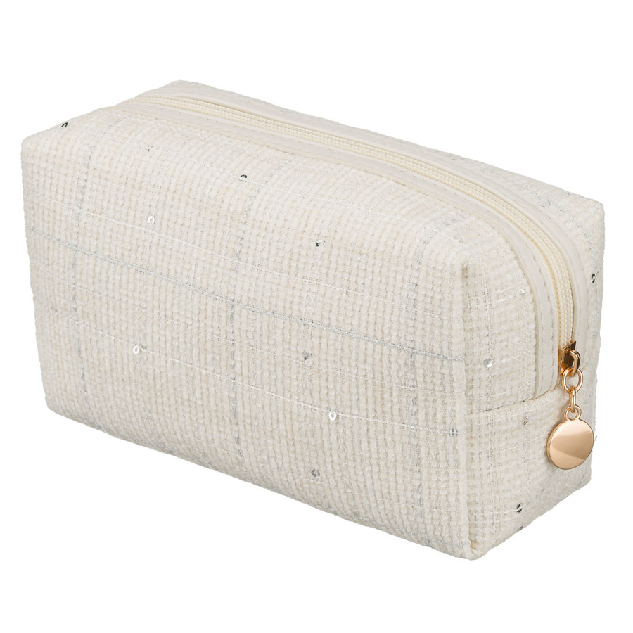 Pojemna kosmetyczka damska wykonana z materiału syntetycznego w beżowym kolorze, zamykana suwakiem - Rovicky